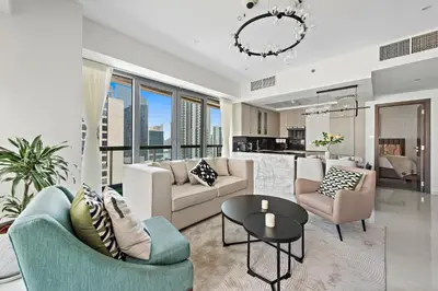 a living room with a couch and a table at FIRST CLASS 2BR with Full Boulevard View in Dubai