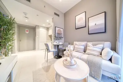 a living room with a couch and a table at Special Deal Scenic 1BR Close to Burj Khalifa by Deluxe Holiday Homes in Dubai