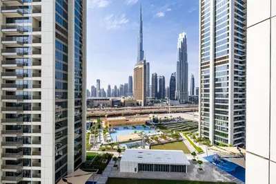 an aerial view of a city with tall buildings at 3BDR with Maid Room I Downtown I Burj Khaliva View in Dubai