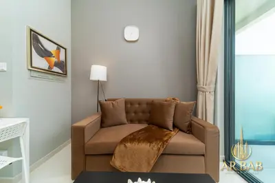 a living room with a couch in a room at Arbab Homes Luxury 1BR- Canal View - Damac Zada Tower in Dubai