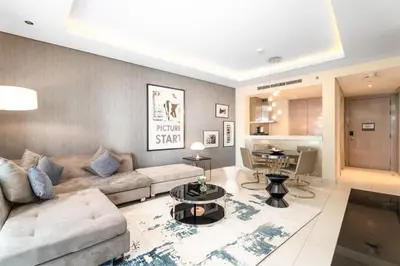 a living room with a couch and a table at ALiving Classy 1BR I Paramount Towers, Business Bay- 6105 in Dubai
