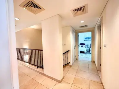 a hallway of a house with aoyer with a balcony at Golf Facing 5Bedroom Villa in Novelia Village in Dubai