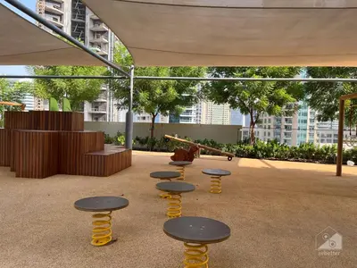 a group of tables and stools in a courtyard at Luxury Burj Royale Burj Khalifa & Fountain view in Dubai