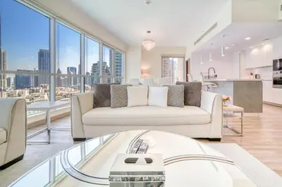 a living room with a couch and some windows at Burj Residence 1, Downtown Dubai - Mint Stay in Dubai