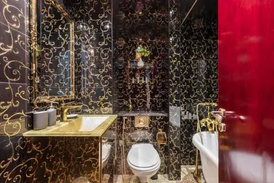 a bathroom with a toilet and a sink at StoneTree - Elegant Studio in Goldcrest View in Dubai