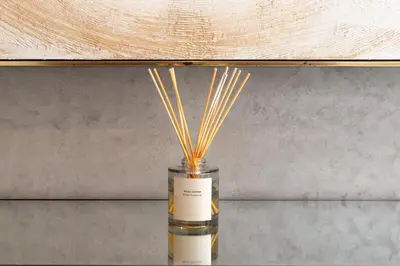 a vase with reeds in it on a table at High floor Luxury 2BR - Dubai Marina Gate in Dubai
