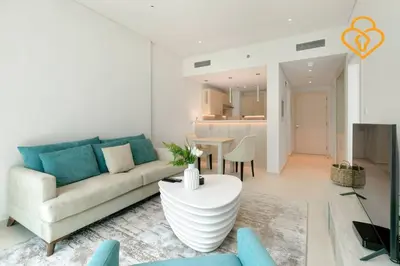a living room with a couch and a table at Keysplease Beautiful 1 B/R Palm Jumeirah Beach Access in Dubai
