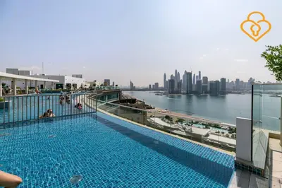 a swimming pool with a view of the city at Keysplease Beautiful 1 B/R Palm Jumeirah Beach Access in Dubai