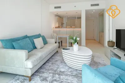 a living room with a couch and a table at Keysplease Beautiful 1 B/R Palm Jumeirah Beach Access in Dubai