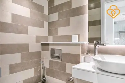 a bathroom with a sink and a mirror at Keysplease Beautiful 1 B/R Palm Jumeirah Beach Access in Dubai