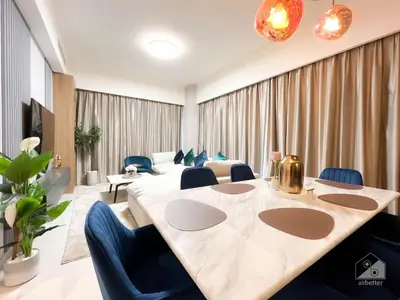 a conference room with a large table and blue chairs at Luxurious Apt with breathtaking view in Downtown in Dubai