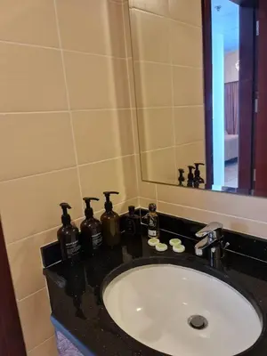 a bathroom counter with a sink and a mirror at Studio in Dubai