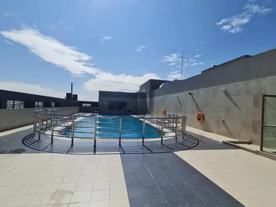 a swimming pool on top of a building at Studio in Dubai