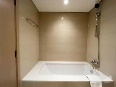 a white bath tub in a bathroom with a shower at Majestic 2Bedroom in Burj Royale Downtown in Dubai