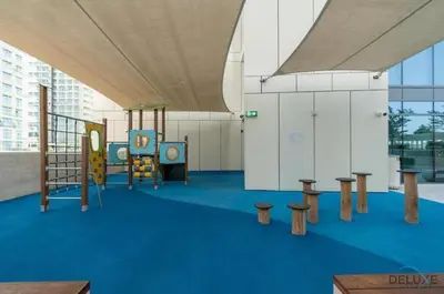 a childrens play area with tables and a swing at Inviting 1BR at Beach Vista Tower 1 Emaar Beachfront Dubai Marina by Deluxe Holiday Homes in Dubai