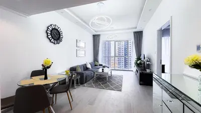 a living room with a couch and a table at Jumeriah Lake Tower(JLT)- (MAG214)(2) in Dubai