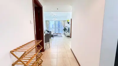a hallway leading to a living room with a stairway at Jumeriah Lake Tower (JLT)-(MAG214)(1) in Dubai