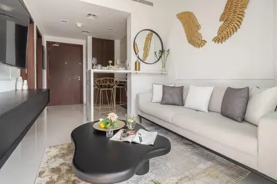 a living room with a couch and a coffee table at Frank Porter - Reva Residences in Dubai