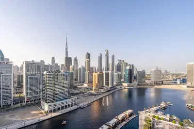 a view of a city with a river and buildings at GuestReady - Mesmerizing views of the Burj Khalifa in Dubai