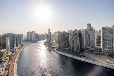 a view of a river in a city with buildings at GuestReady - Mesmerizing views of the Burj Khalifa in Dubai