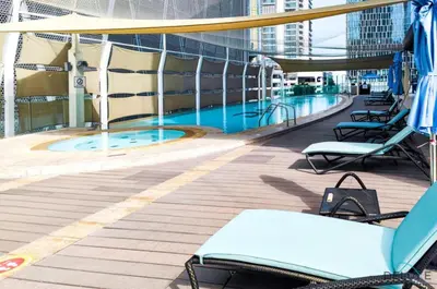 a pool on the deck of a cruise ship at Chic 1BR at The Signature Downtown Dubai by Deluxe Holiday Homes in Dubai