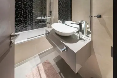a bathroom with a sink and a toilet at Studio with Balcony Skyline View Business Bay in Dubai