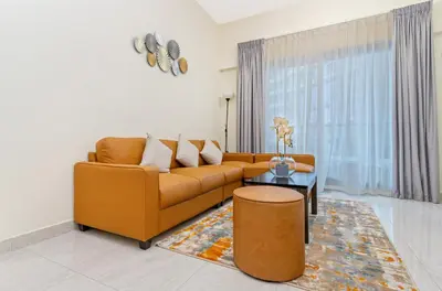 a living room with a couch and a table at Contemporary furnishing I City skyline view in Dubai