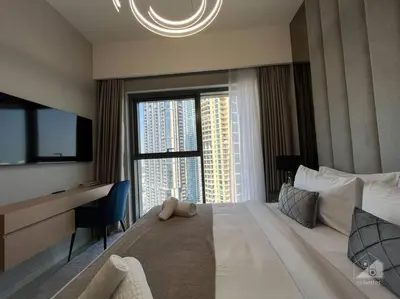 a hotel room with a large bed with a large window at Dreamy Getaway 4B in Burj Royale Downtown in Dubai