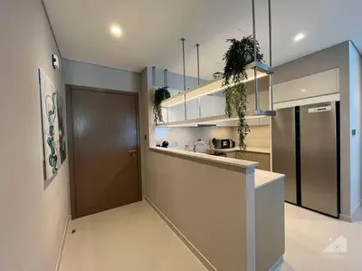 a kitchen with a counter and a door in it at Dreamy Getaway 4B in Burj Royale Downtown in Dubai