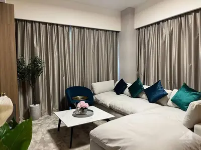 a living room with a couch and a table at Dreamy Getaway 4B in Burj Royale Downtown in Dubai