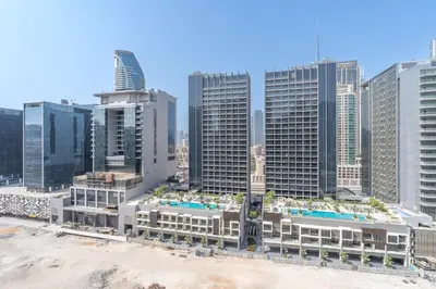 an aerial view of a city with tall buildings at Business Bay Bliss 1 bedroom apartment - Suiteable in Dubai