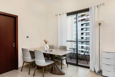 a dining room with a table and chairs at Excellent 1BR Apertments at Bahar 6 in Dubai