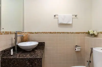 a bathroom with a sink and a toilet at Excellent 1BR Apertments at Bahar 6 in Dubai
