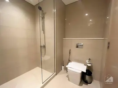 a bathroom with a glass shower and a toilet at NEW! Modern Elegance 2B in Burj Royale Downtown in Dubai