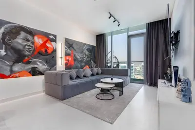 a living room with a couch and a table at One Bedroom - 10min from Burj Khalifa - Lagoon View in Dubai