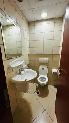 a bathroom with a sink and a toilet at The Sand Castle- Pinnacle tower, Dubai Marina, Near metro in Dubai