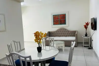 a living room with a table and a couch at The Sand Castle- Pinnacle tower, Dubai Marina, Near metro in Dubai
