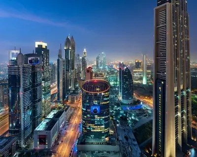a view of a city at night with buildings at Central Park Towers, City View - DIFC - Mint Stay in Dubai