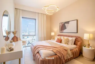 a bedroom with a large bed and a large window at Manzil - Sleek 1BR Home in Dubai Creek with Beach & Marina Access in Dubai