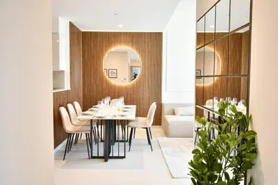 a dining room with a table and chairs at Burj Royale-Enchanting Burj&Fountain full view Sky APT 3+1BR in Dubai