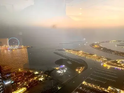 an aerial view of a city at night at Your Cosy Dubai Marina Home in Dubai