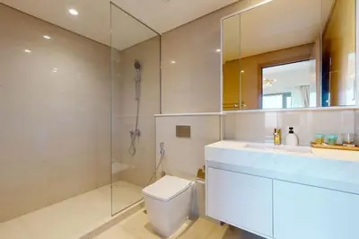 a bathroom with a toilet and a shower and a sink at Vacationer I Elegant 2 Bed with City Views I Walk to Dubai Mall & Burj Khalifa I Downtown I Burj Royale Tower in Dubai