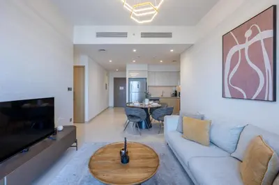 a living room with a couch and a table at Vacationer I Elegant 2 Bed with City Views I Walk to Dubai Mall & Burj Khalifa I Downtown I Burj Royale Tower in Dubai