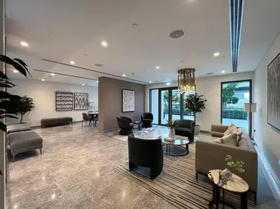 a living room with a couch and chairs and a table at cinematic&Chic Burj Khalifa &Fountain View 2BR APT in Dubai