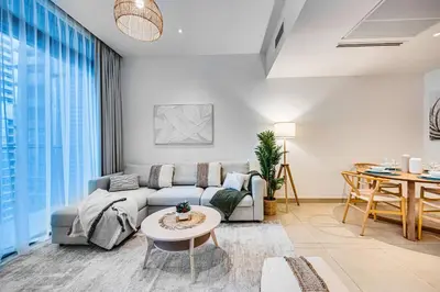 a living room with a couch and a table at Amazing 1 BD in Marina Gate 2 Dubai Marina in Dubai