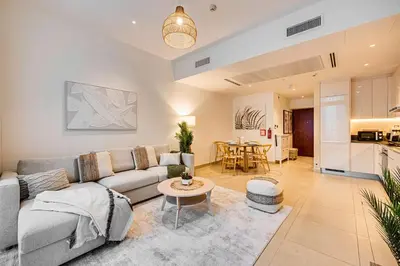 a living room with a couch and a table at Amazing 1 BD in Marina Gate 2 Dubai Marina in Dubai