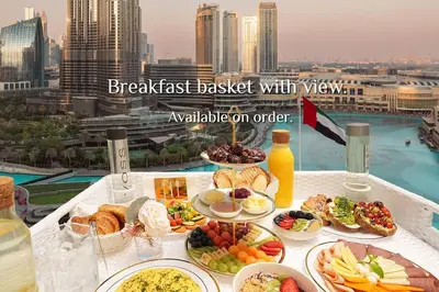 a breakfast buffet with a view of a city at Elite Royal Apartment - Full Burj Khalifa & Fountain View - 2 Bedrooms + 1 Open Bedroom Without Partition - Magnate in Dubai