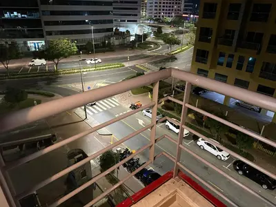 an aerial view of a city street at night at Cityview Partition Room with Balcony in Tecom in Dubai