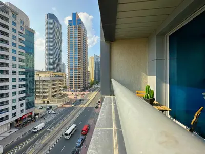 a view of a city street from a building at Luxury Studio w/ BoHo Design and Balcony for 4 Pax in Dubai