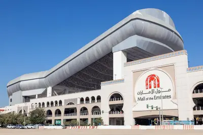 a large white building with a sign on it at Partition Room 3 Mins to Mashreq Metro in Dubai